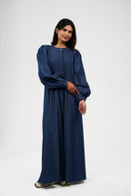 فستان ماكسي دنيم بقصة واسعة وأكمام منفوشة